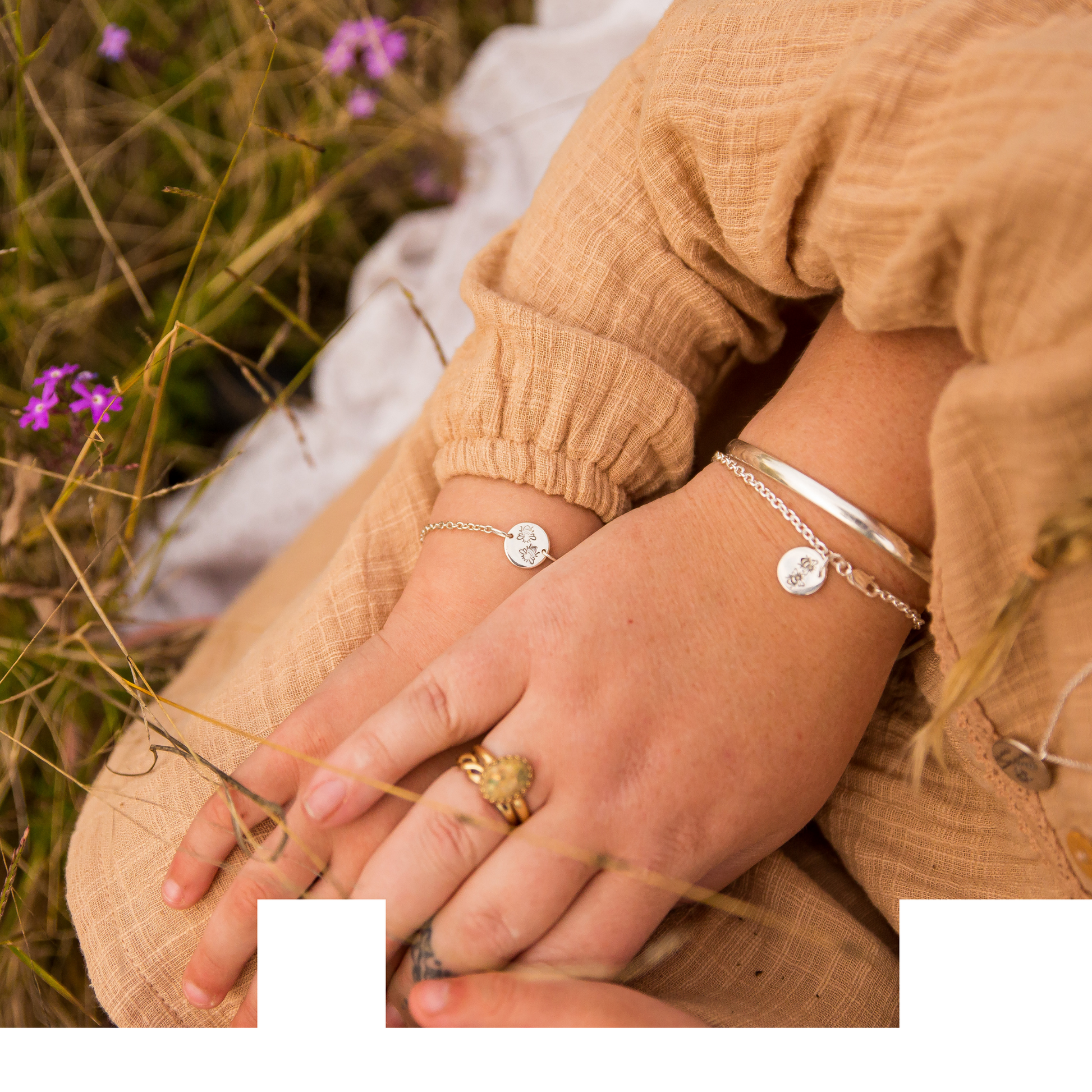 Bee bracelets being worn by mother and daughter